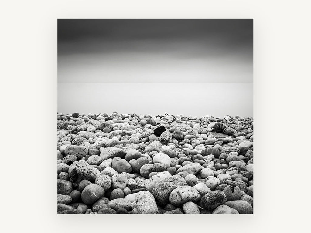 Pebble Shore Stillness, coastal canvas wall art print, front view