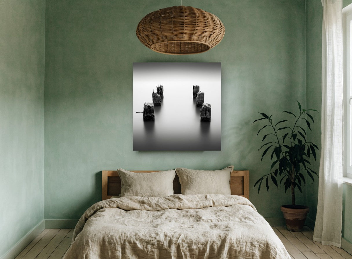 Silent Pier Stumps coastal canvas print on the wall of a bedroom