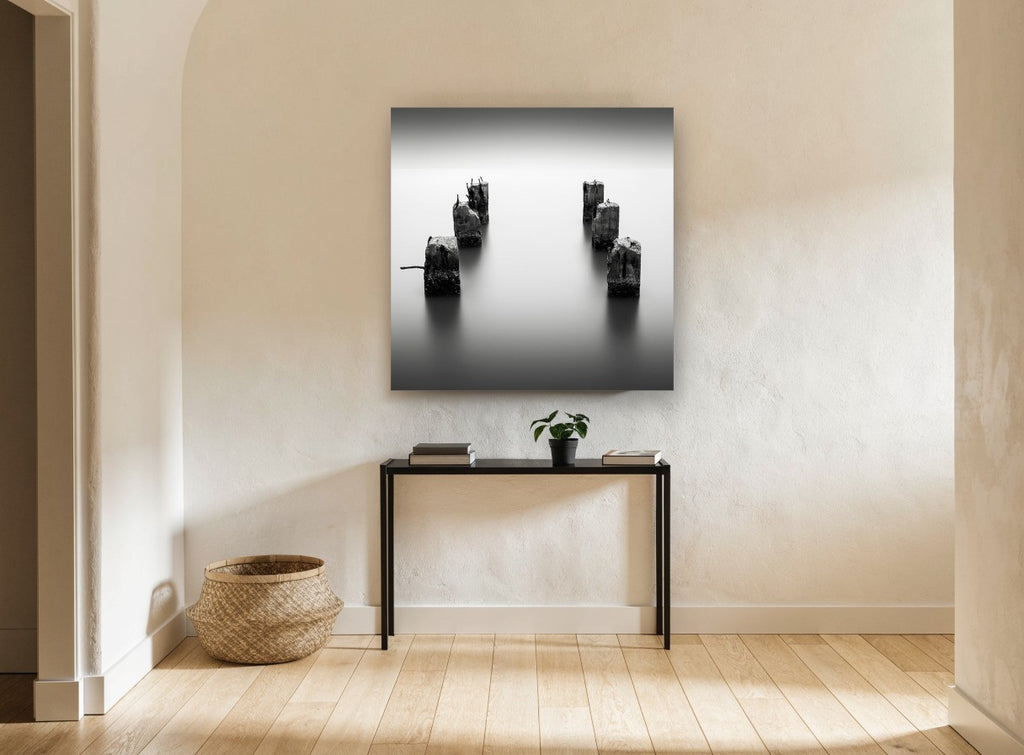 Silent Pier Stumps coastal canvas print on the wall of a hallway