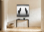 Silent Pier Stumps coastal canvas print on the wall of a hallway