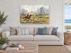 Hounds Across the Meadow animal canvas print on the wall of a beach house living room