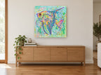 Patterned Angelfish Pop coastal canvas print on the wall of a living room above a sideboard