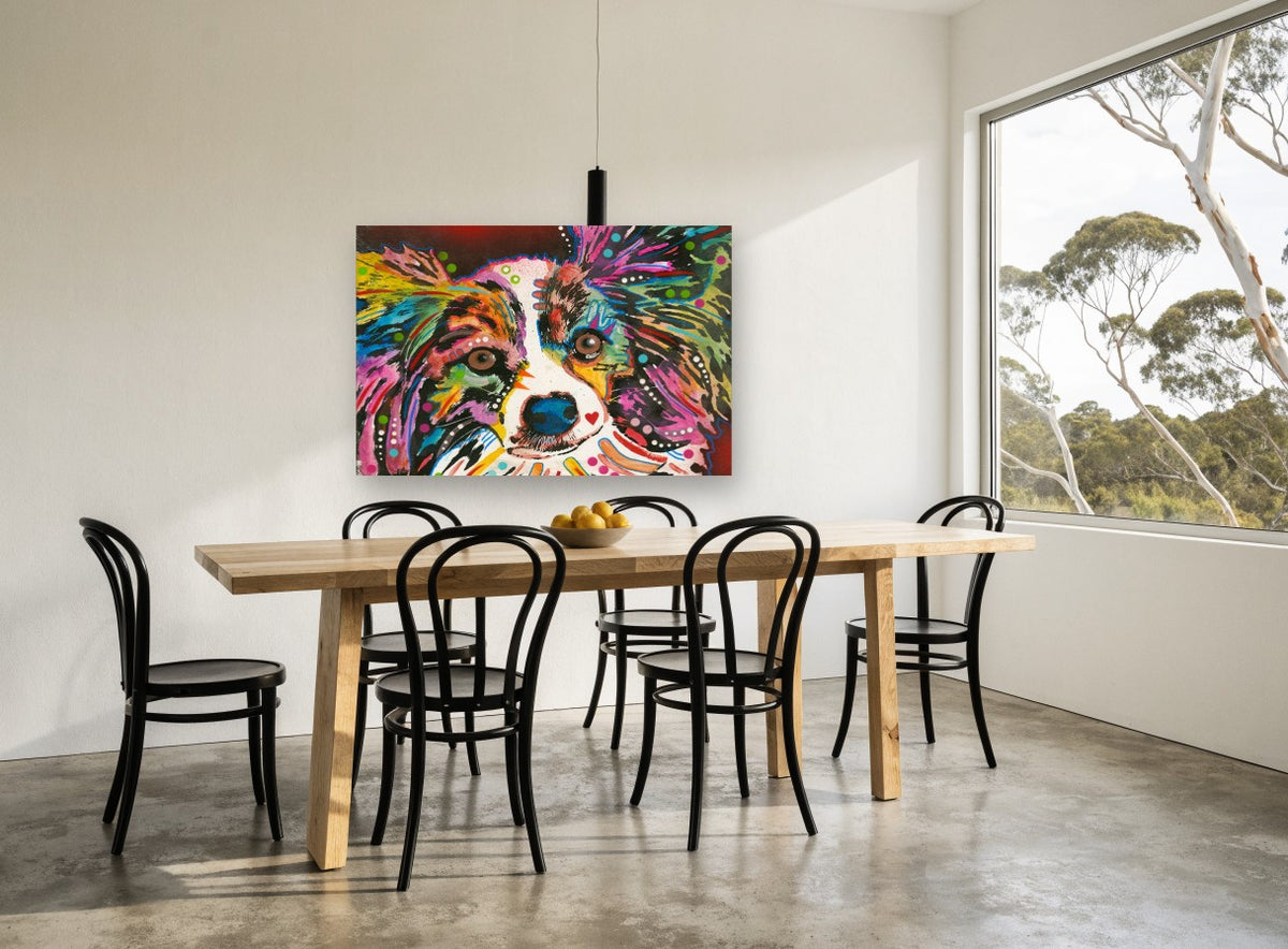 Rainbow Papillon Stare animal canvas print on the wall of a dining room