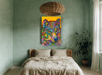 Technicolour Wolf Gaze animal canvas print on the wall of a bedroom