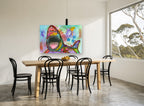 Neon Shark Burst animal canvas print on the wall of a dining room