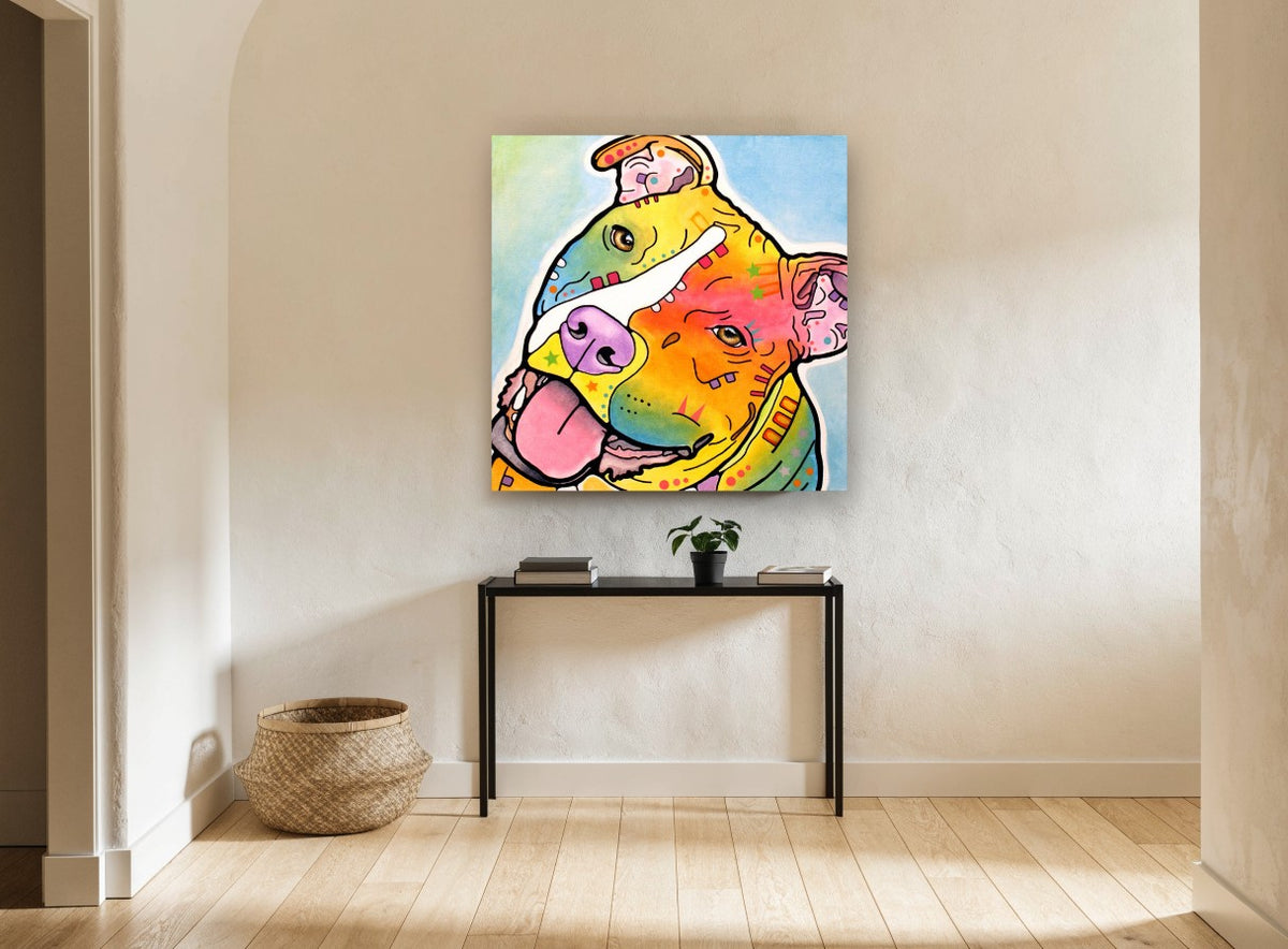 Tilted Head Rainbow Staffy animal canvas print on the wall of a hallway