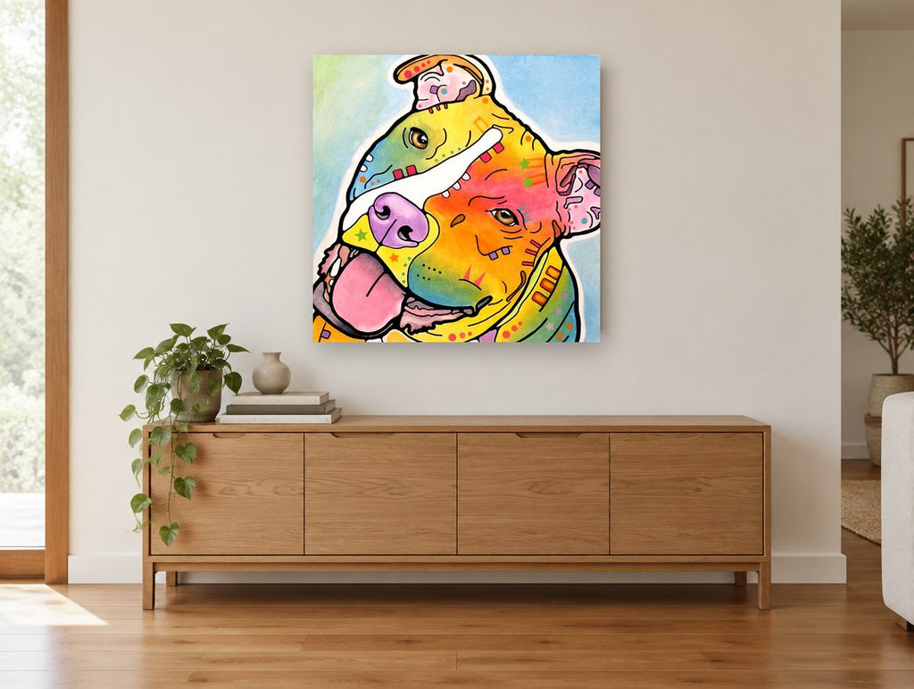 Tilted Head Rainbow Staffy animal canvas print on the wall of a living room above a sideboard