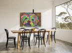 Rainbow Shih Tzu Gaze animal canvas print on the wall of a dining room