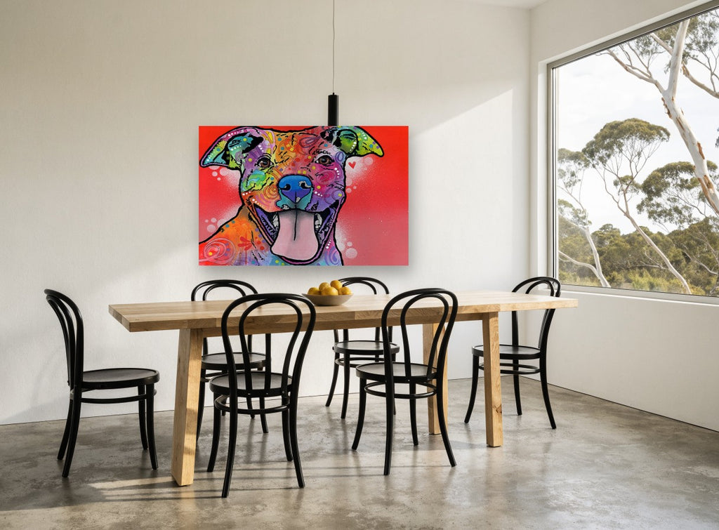Grinning Rainbow Pitbull animal canvas print on the wall of a dining room