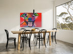 Grinning Rainbow Pitbull animal canvas print on the wall of a dining room