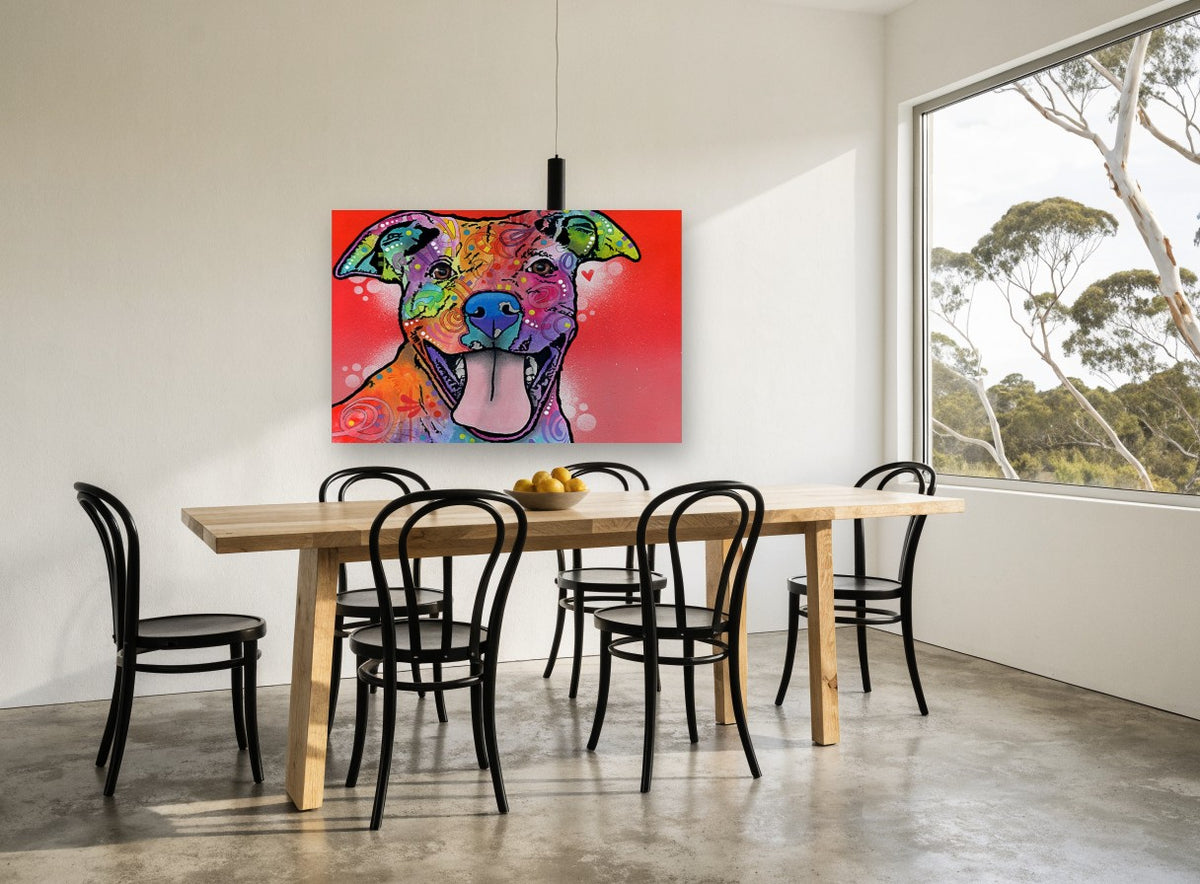 Grinning Rainbow Pitbull animal canvas print on the wall of a dining room