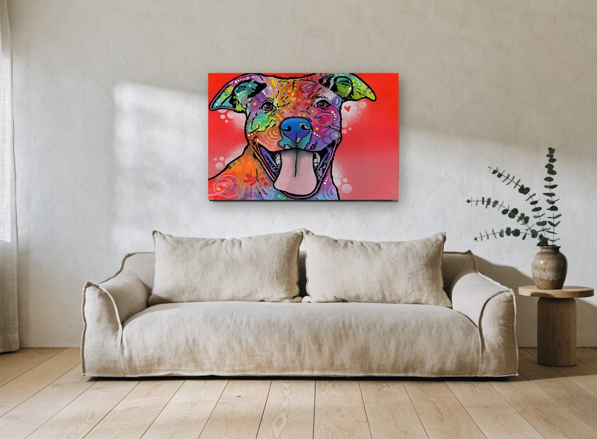 Grinning Rainbow Pitbull animal canvas print on the wall of a living room