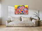 Smiling Rainbow Pup animal canvas print on the wall of a living room