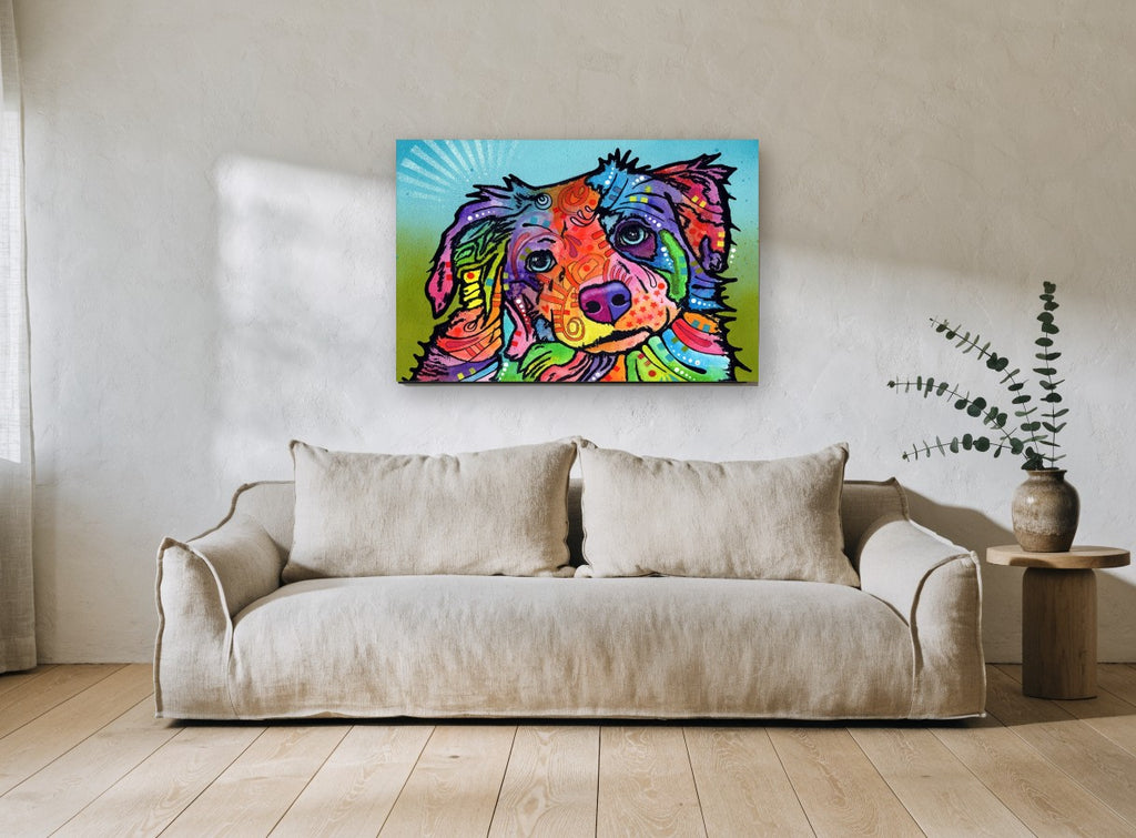 Tilted Head Rainbow Pup animal canvas print on the wall of a living room