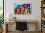Tilted Head Rainbow Pup animal canvas print on the wall of a study