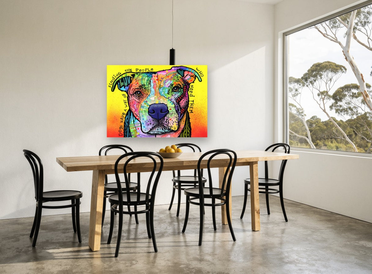 Dogs Find Their People animal canvas print on the wall of a dining room