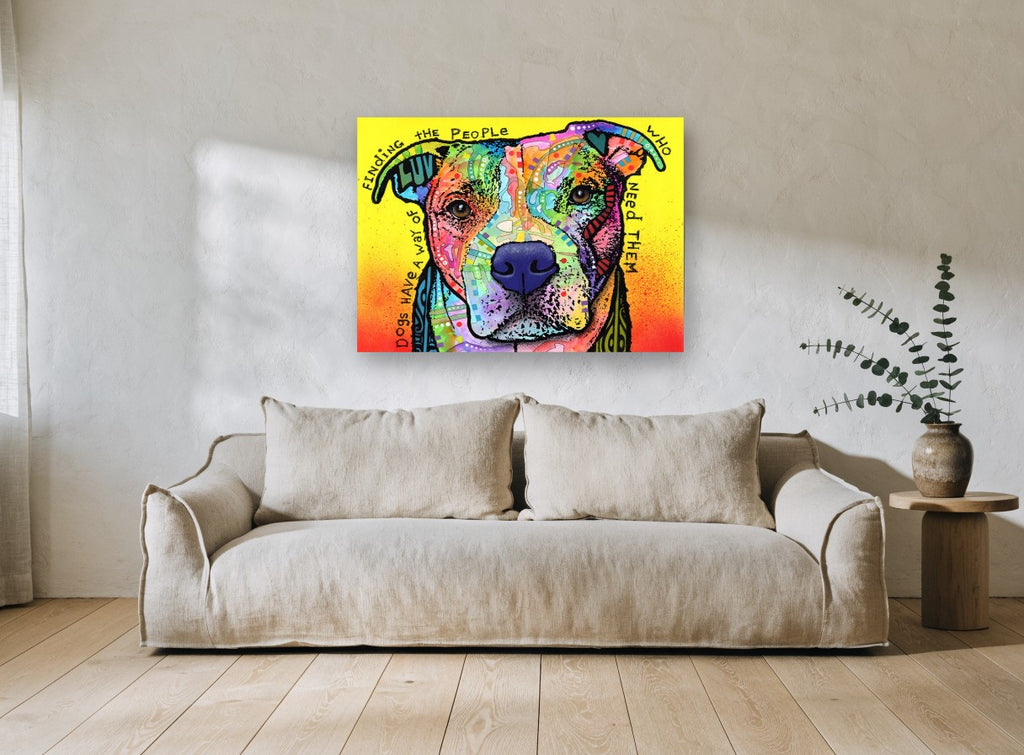Dogs Find Their People animal canvas print on the wall of a living room