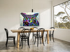 Neon Patchwork Owl animal canvas print on the wall of a dining room