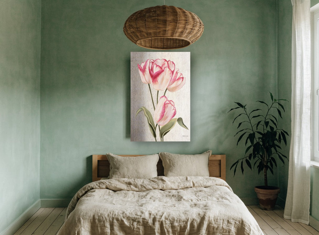 Blush Tulip Trio floral canvas print on the wall of a bedroom
