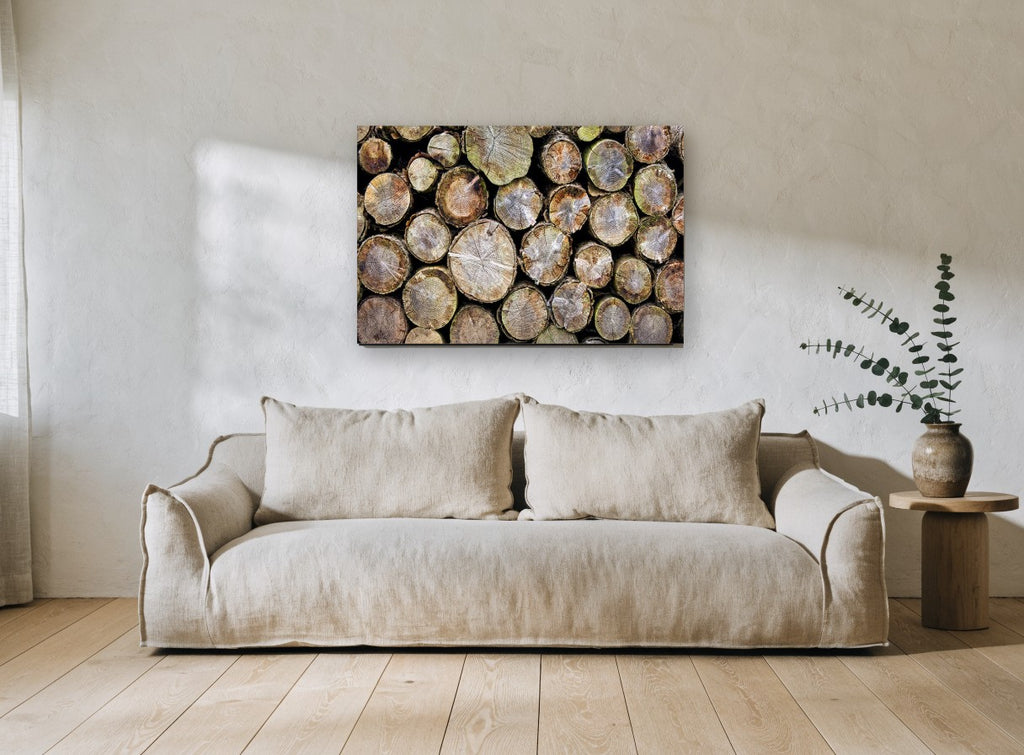 Stacked Log Ends landscape canvas print on the wall of a living room