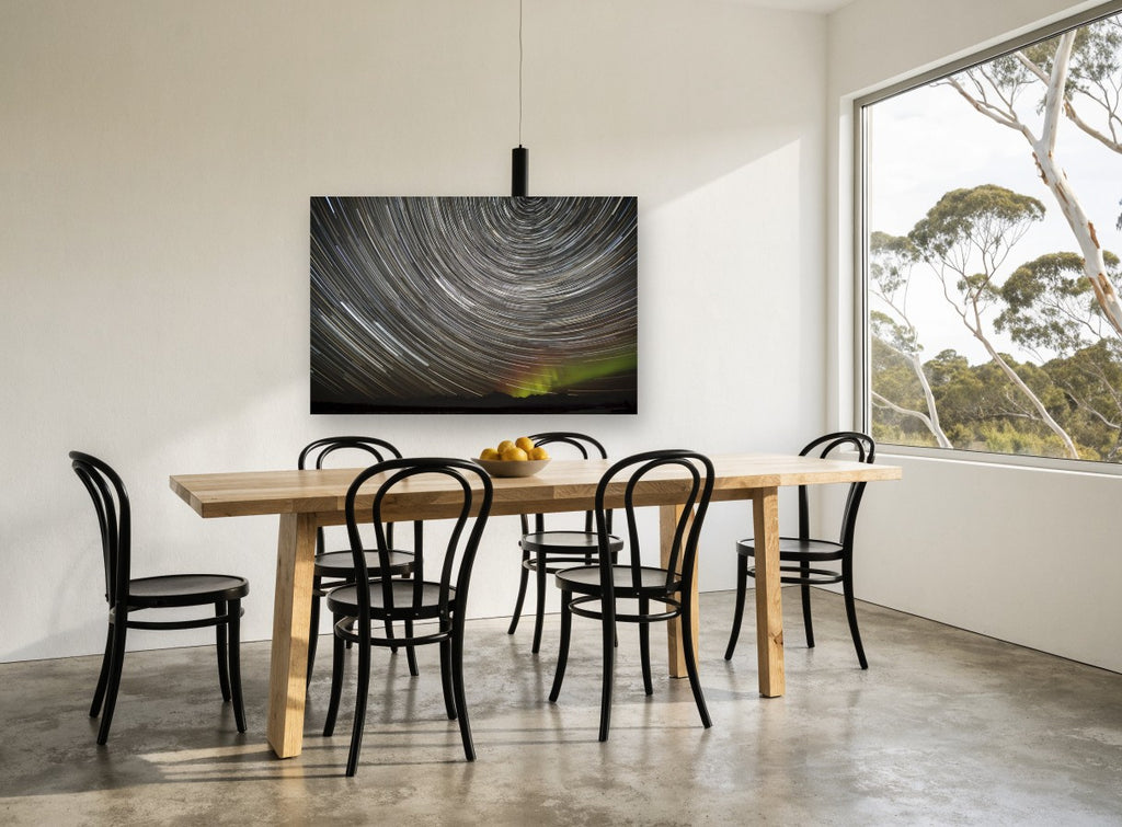 Circling Star Trails landscape canvas print on the wall of a dining room