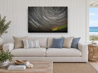 Circling Star Trails landscape canvas print on the wall of a beach house living room