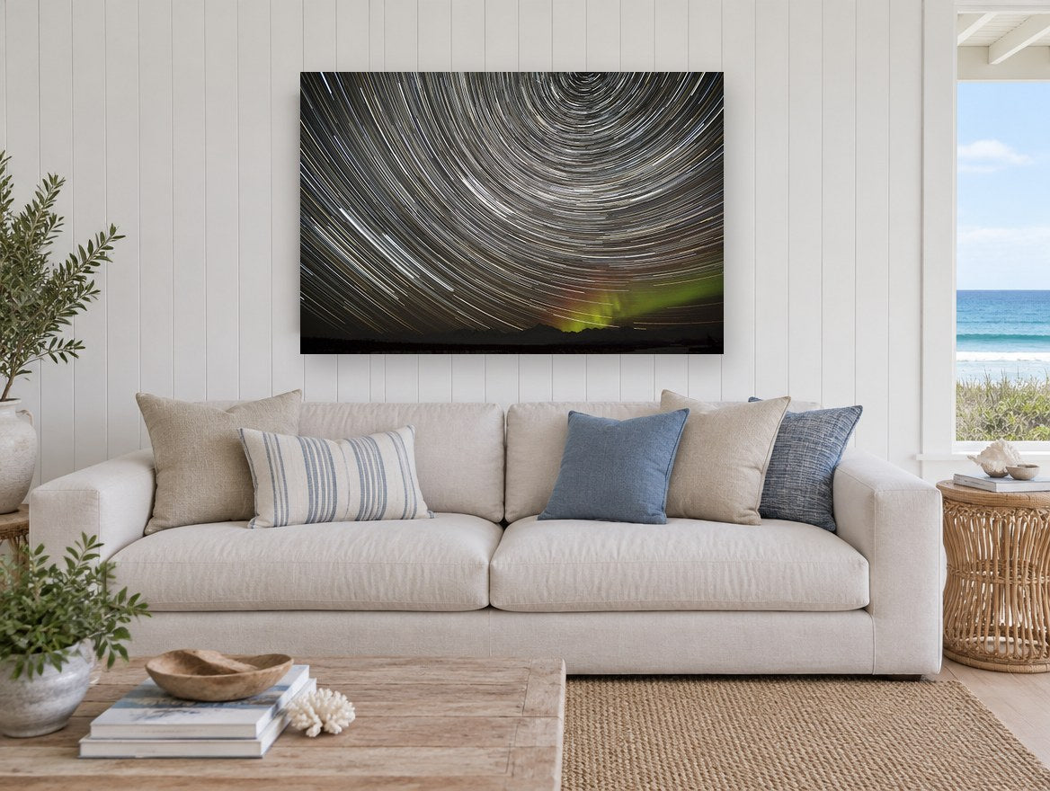 Circling Star Trails landscape canvas print on the wall of a beach house living room