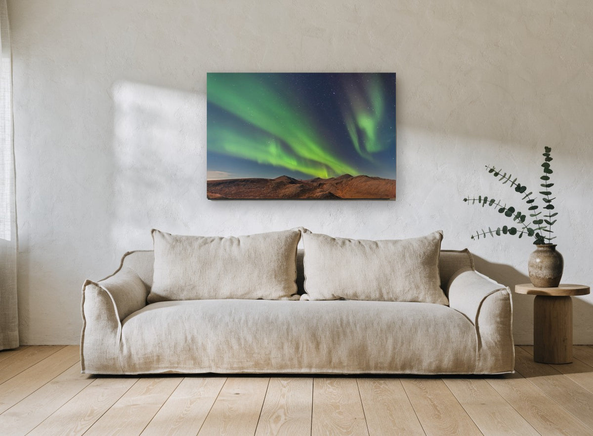 Green Aurora Ridge landscape canvas print on the wall of a living room