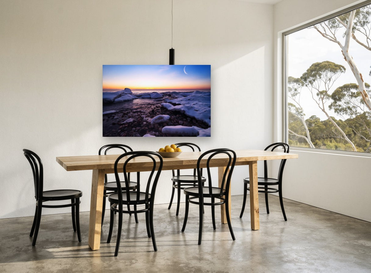 Crescent Moon Over Frozen Shore coastal canvas print on the wall of a dining room