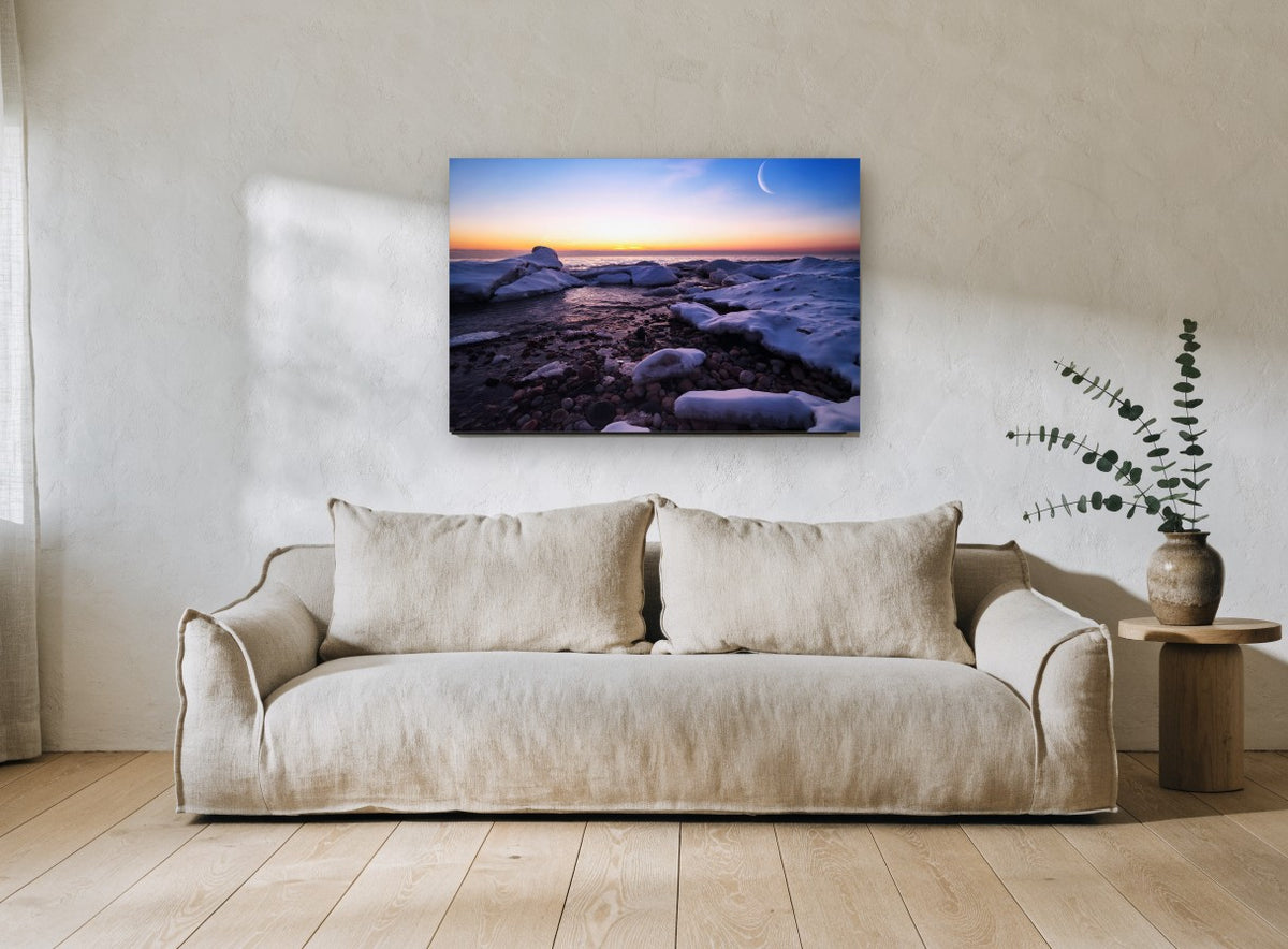 Crescent Moon Over Frozen Shore coastal canvas print on the wall of a living room