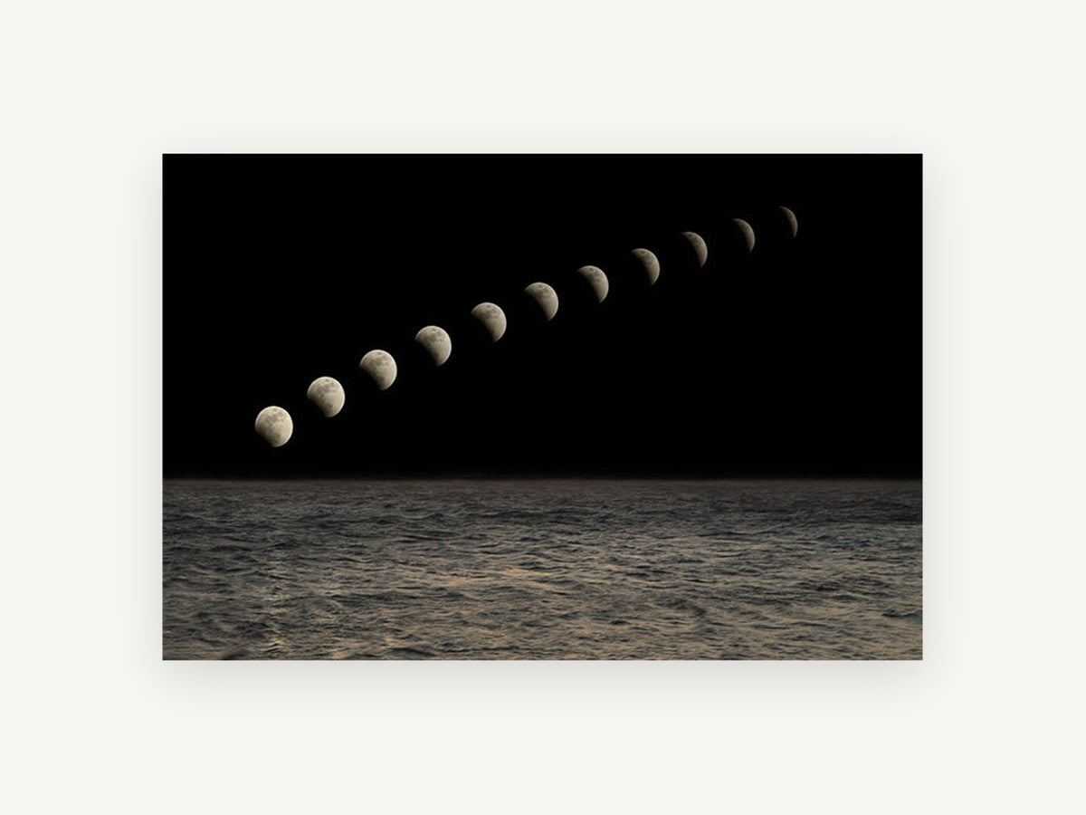 Moon Phases Over Sea, coastal canvas wall art print, front view