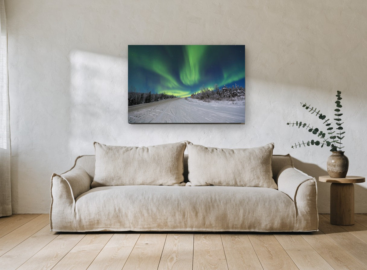 Aurora Over Snowy Road landscape canvas print on the wall of a living room