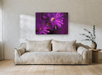 Purple Blooms Through Glass floral canvas print on the wall of a living room