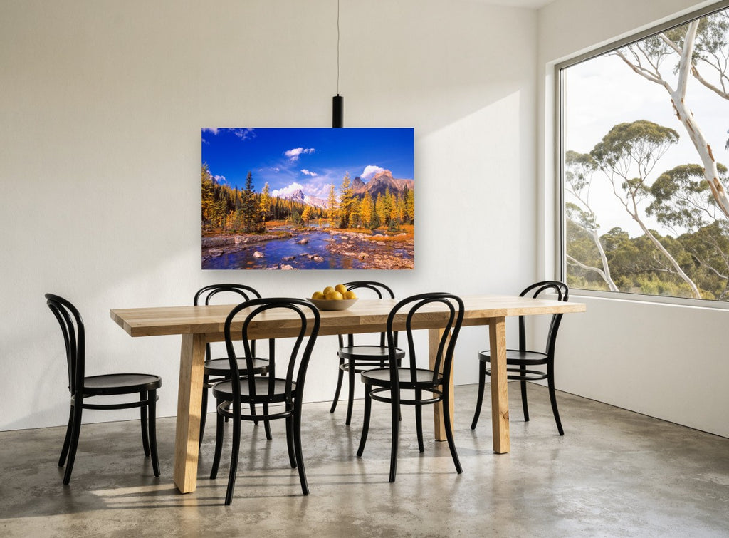 Golden Larch Creek landscape canvas print on the wall of a dining room