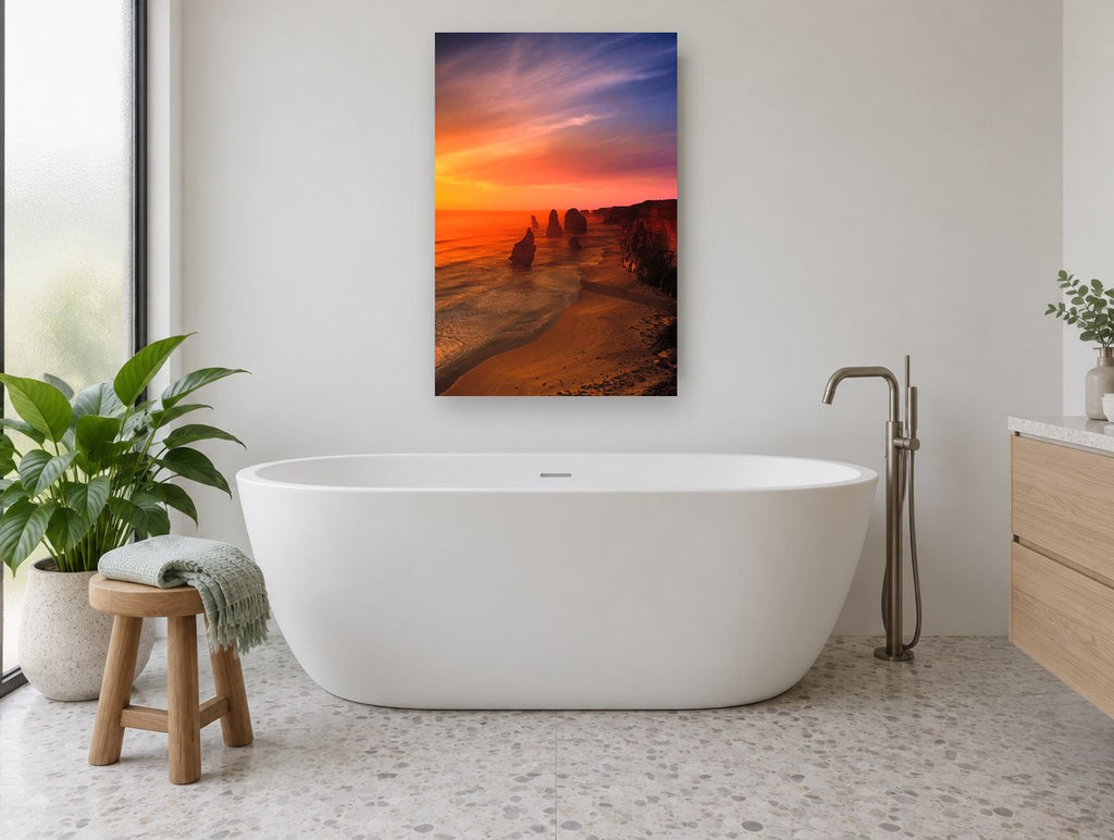 Ember Sky Sea Stacks coastal canvas print on the wall of a bathroom