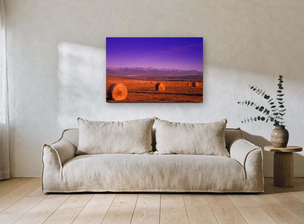 Purple Dusk Hay Bales landscape canvas print on the wall of a living room