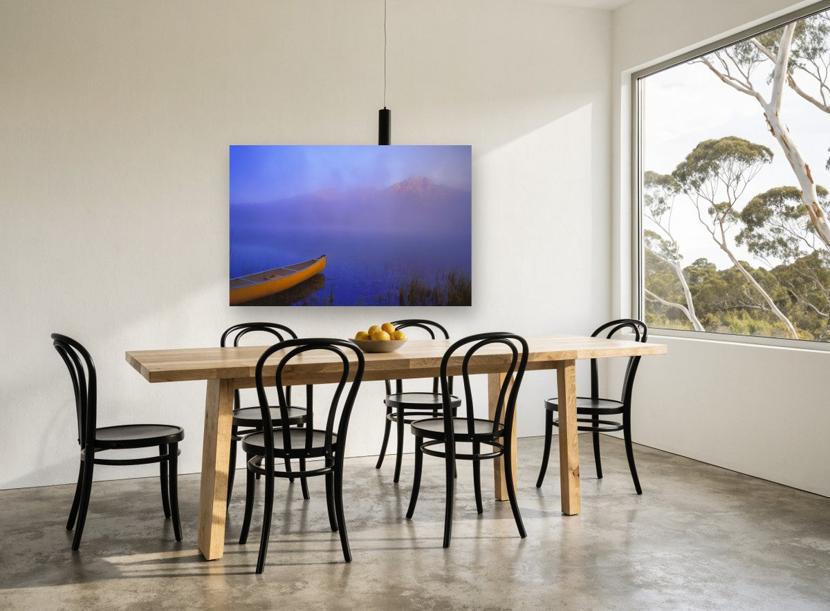 Yellow Canoe at Dawn landscape canvas print on the wall of a dining room