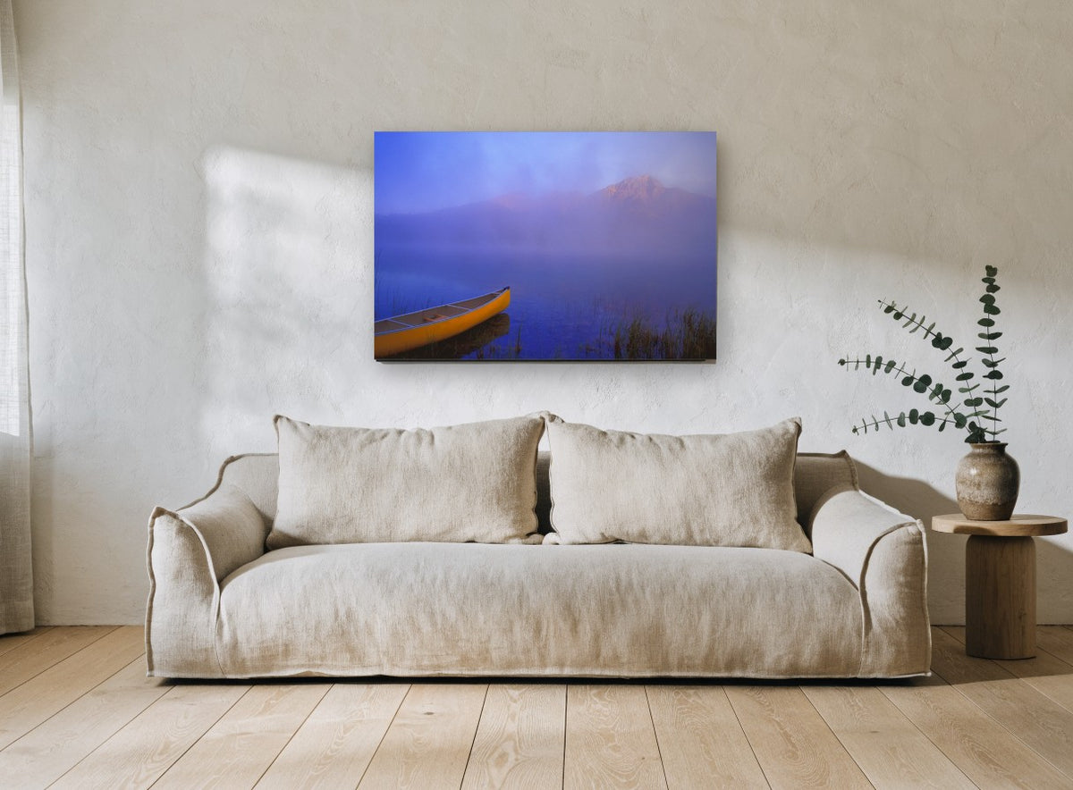 Yellow Canoe at Dawn landscape canvas print on the wall of a living room