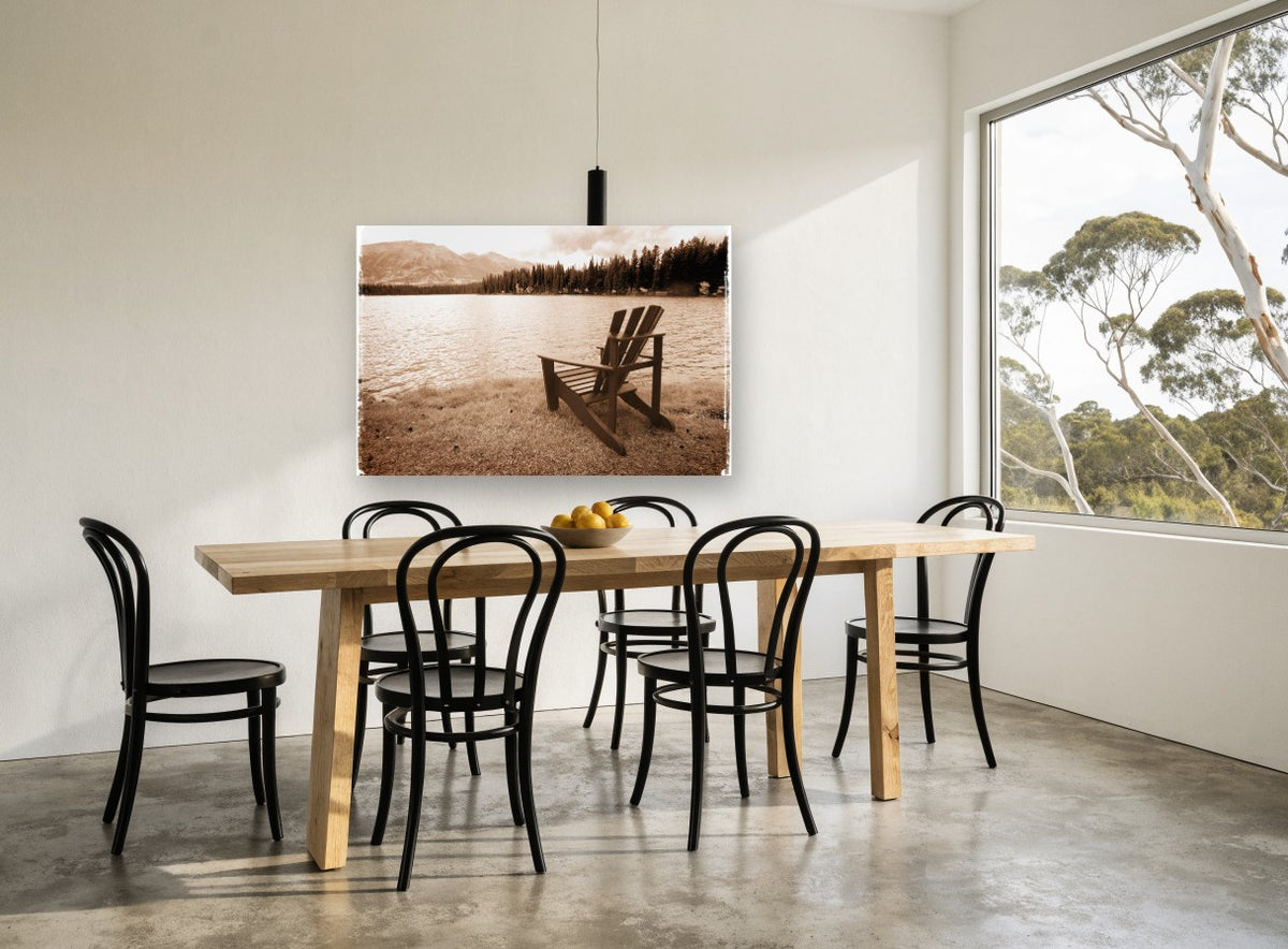 Lakeside Chair Sepia landscape canvas print on the wall of a dining room