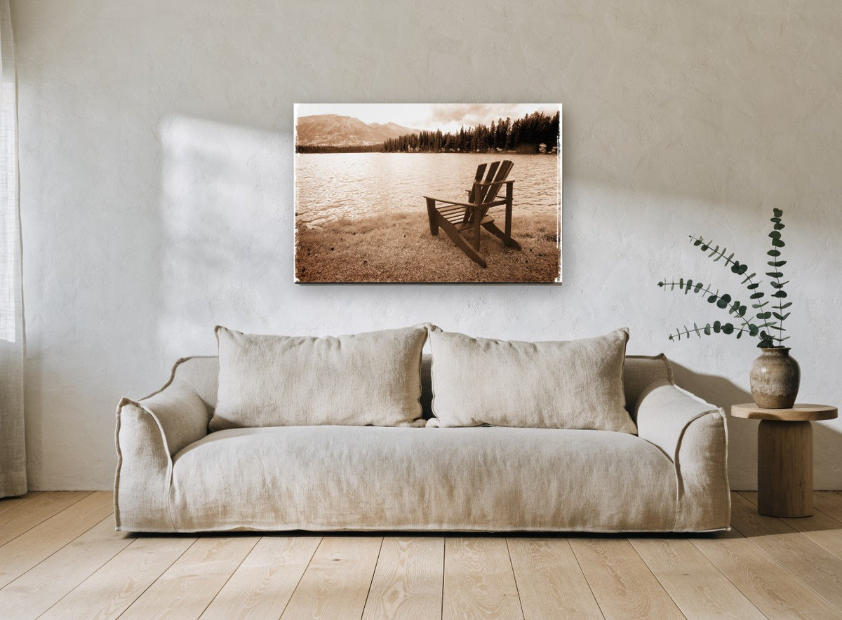 Lakeside Chair Sepia landscape canvas print on the wall of a living room