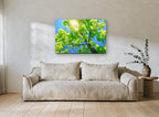 Sunlit Maple Canopy landscape canvas print on the wall of a living room