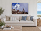 Stupa Beneath the Peak landscape canvas print on the wall of a beach house living room