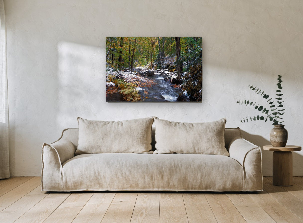 First Snow Creek landscape canvas print on the wall of a living room