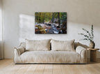 First Snow Creek landscape canvas print on the wall of a living room