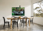 Garden Wheelbarrow Planter floral canvas print on the wall of a dining room
