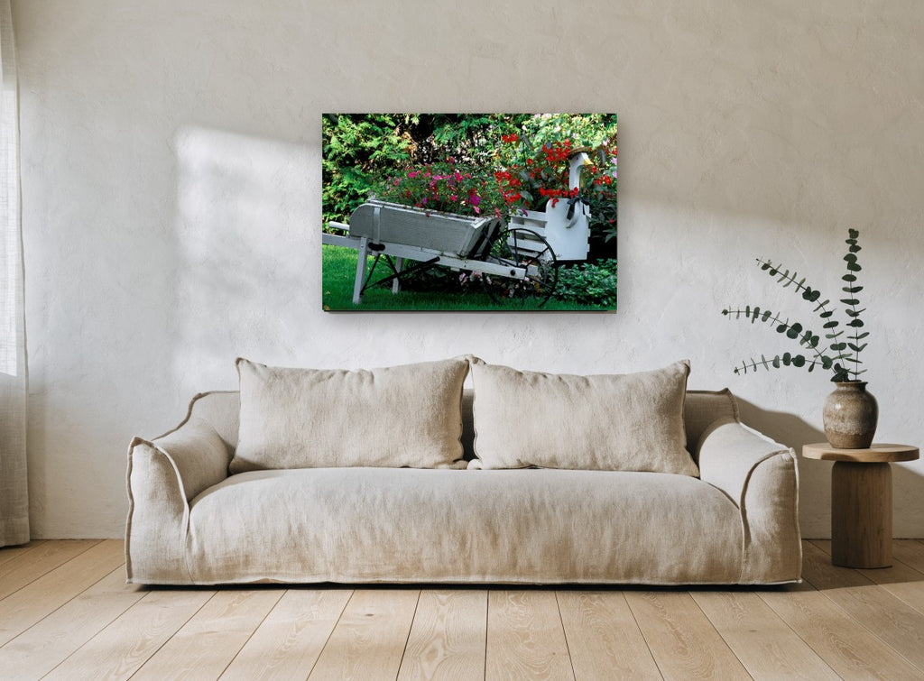 Garden Wheelbarrow Planter floral canvas print on the wall of a living room