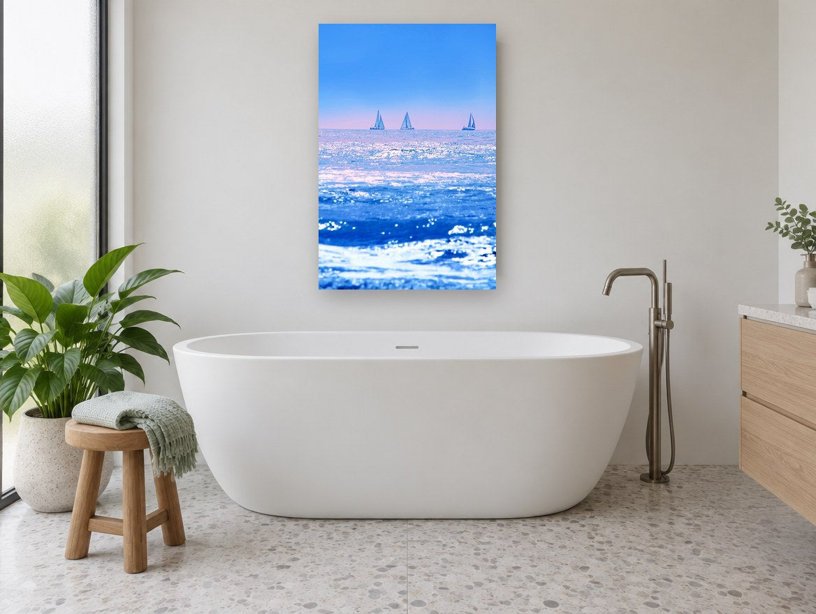 Three Sails Blue Horizon coastal canvas print on the wall of a bathroom