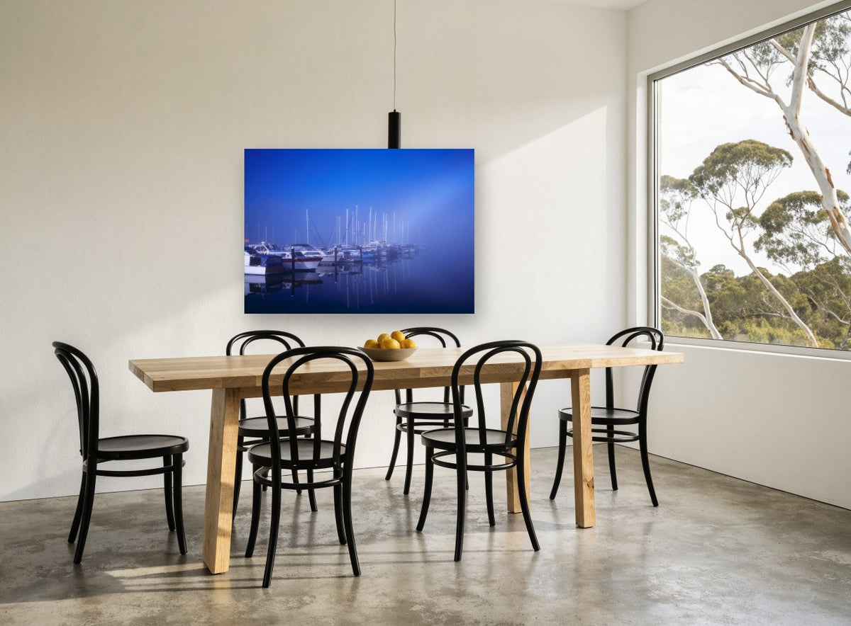 Blue Fog Marina coastal canvas print on the wall of a dining room