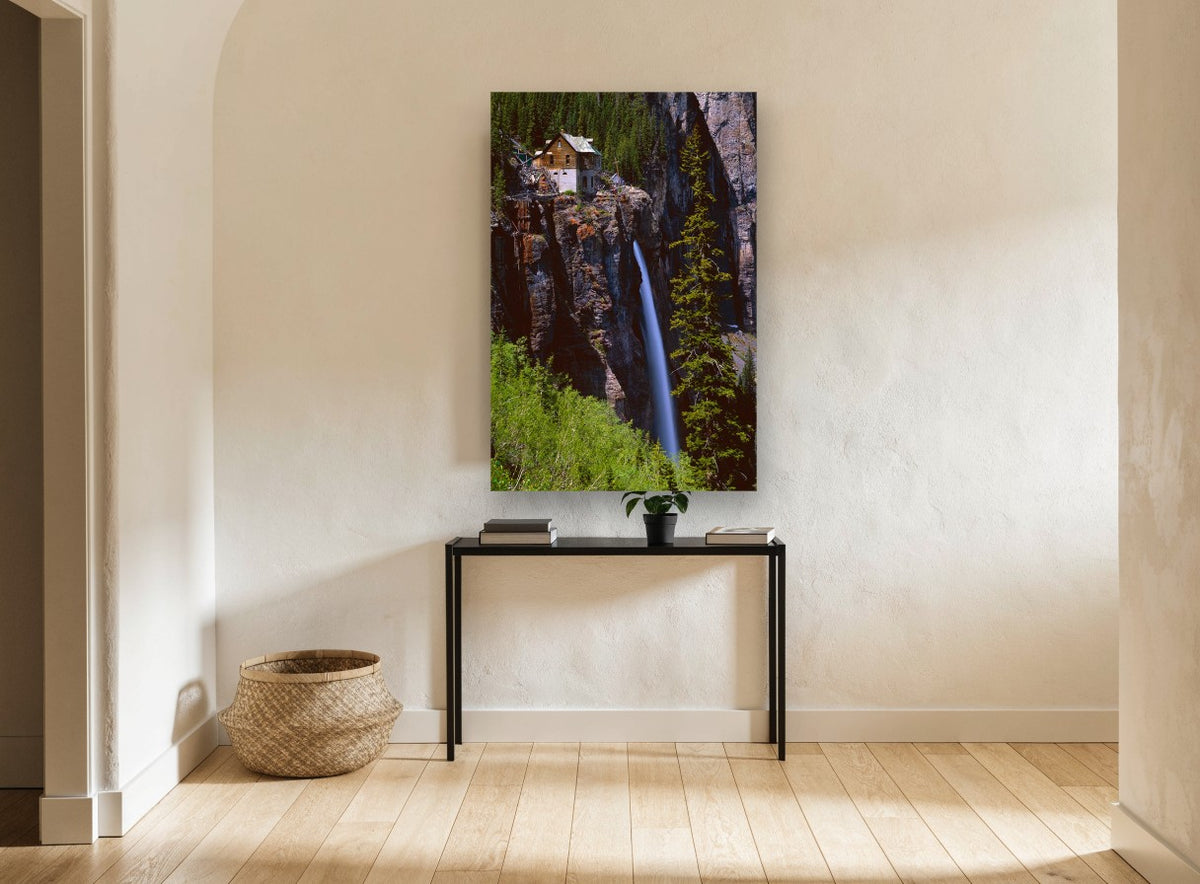 Cliffside Cabin Falls landscape canvas print on the wall of a hallway