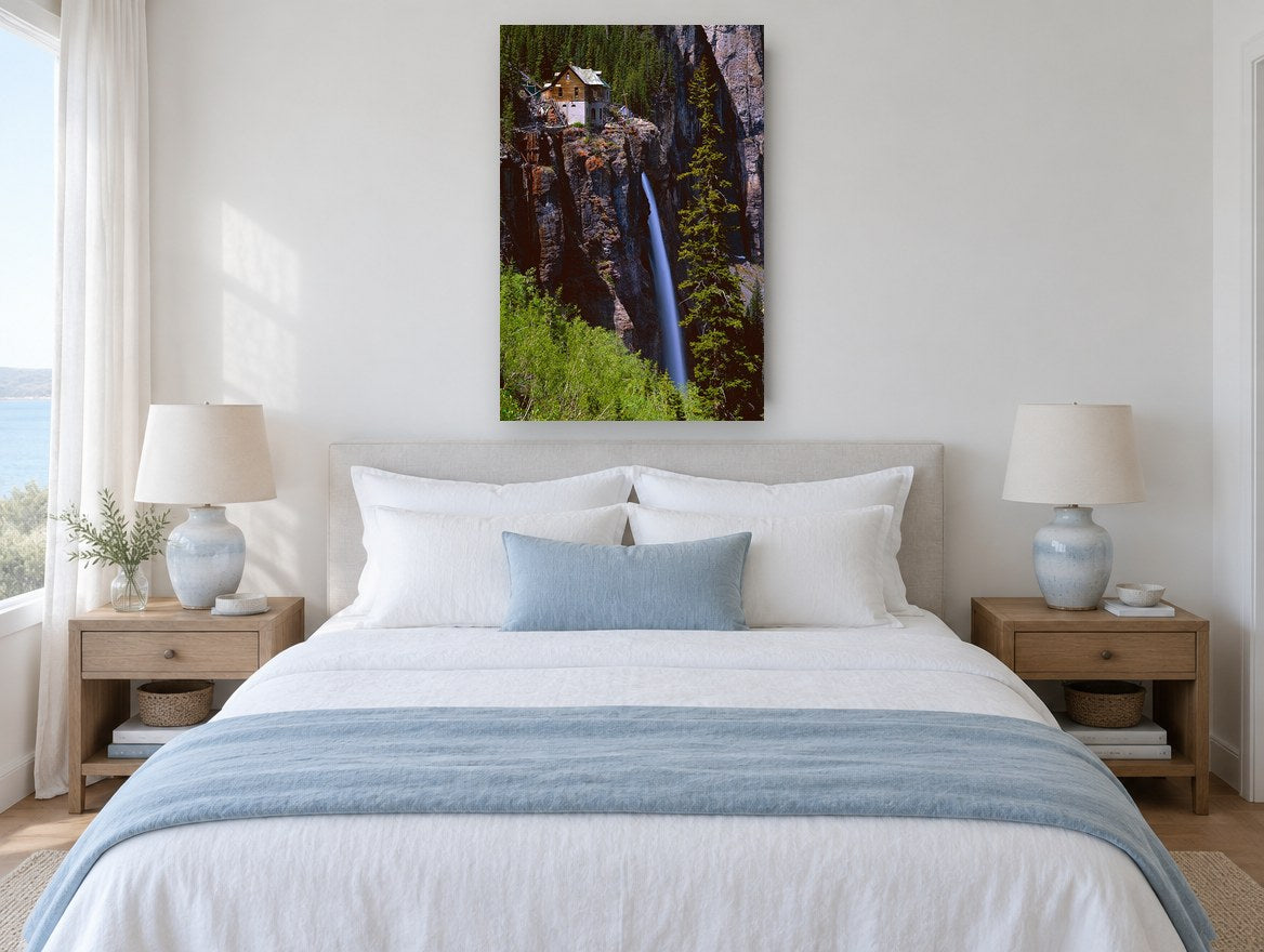Cliffside Cabin Falls landscape canvas print on the wall of a bedroom